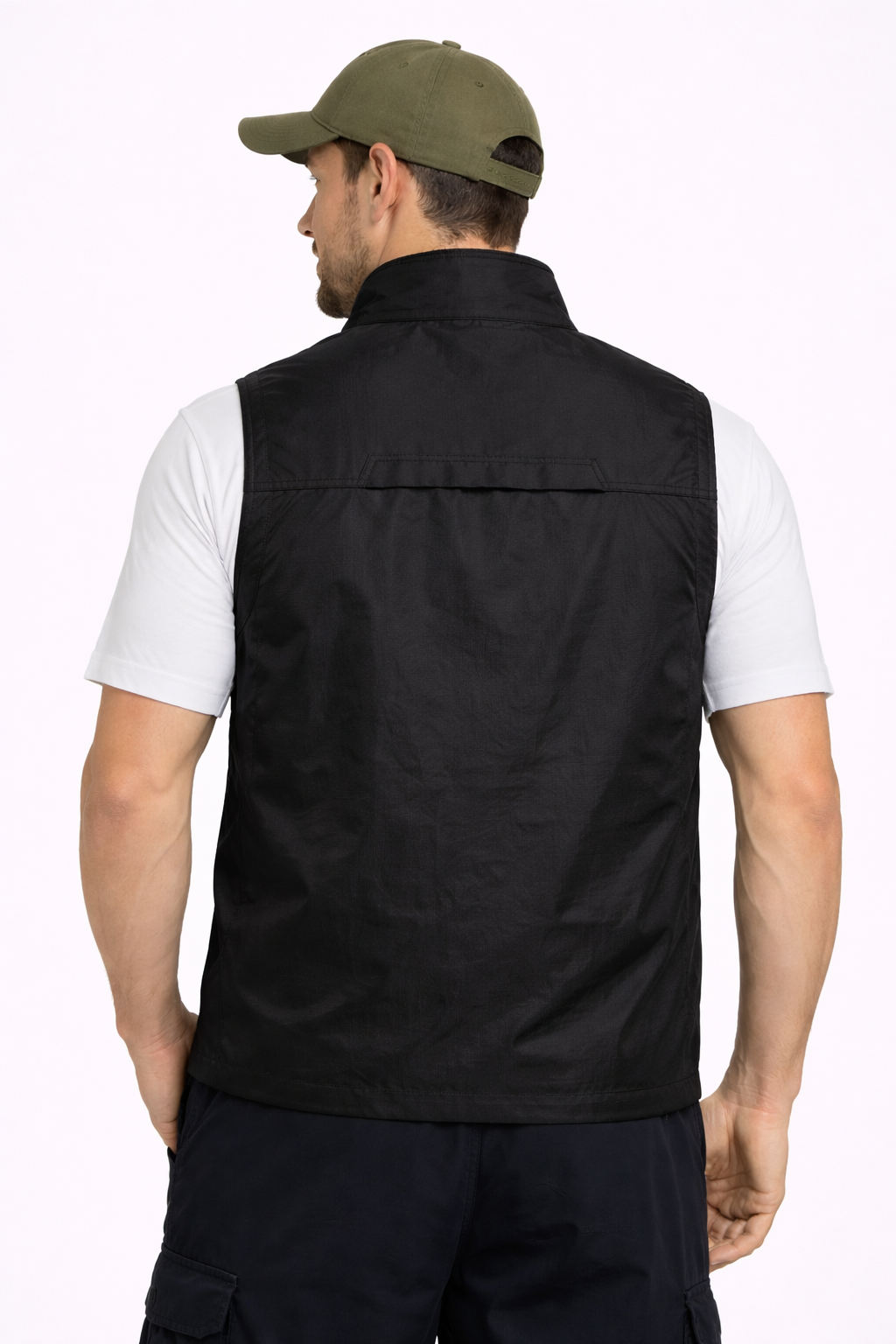 https://cdn.shopify.com/s/files/1/0821/1087/3856/files/Man_wearing_a_black_vest_white_shirt_and_green_cap_on_a_white_background.png?v=1774106093